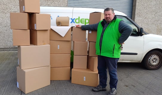Assembled Eco Budget Moving Kit in front of the Box Depot van with Jerry, one of the Box Depot owners standing beside it for perspective