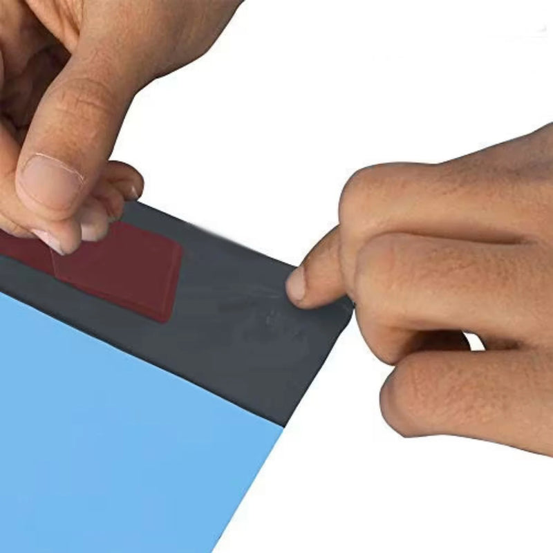 a blue poly mailing bag with  hand closing it