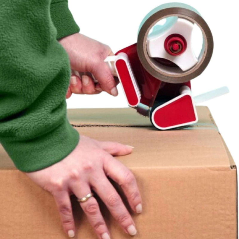 a woman sealing a cardboard box with tape using a pistol grip tape gun