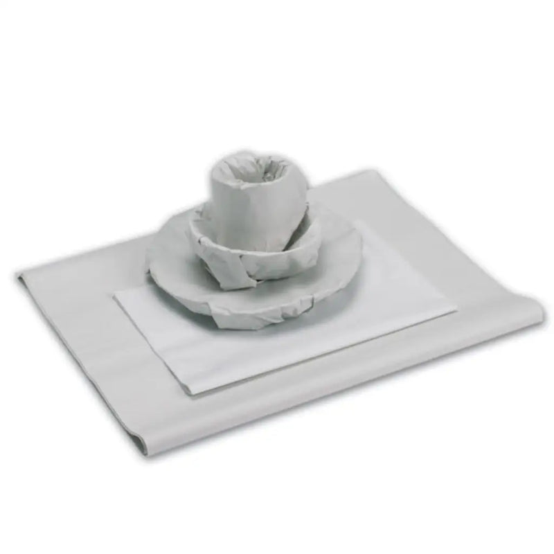 Images of plates and cups wrapped in white packing paper