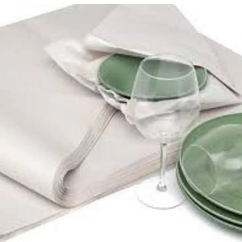 image of dishes and glasses being wrapped in white packing paper