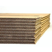 closeup of double walled cardboard boxes that are flatpacked on a white background