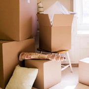 open XL cardboard boxes filled with belongings for moving house