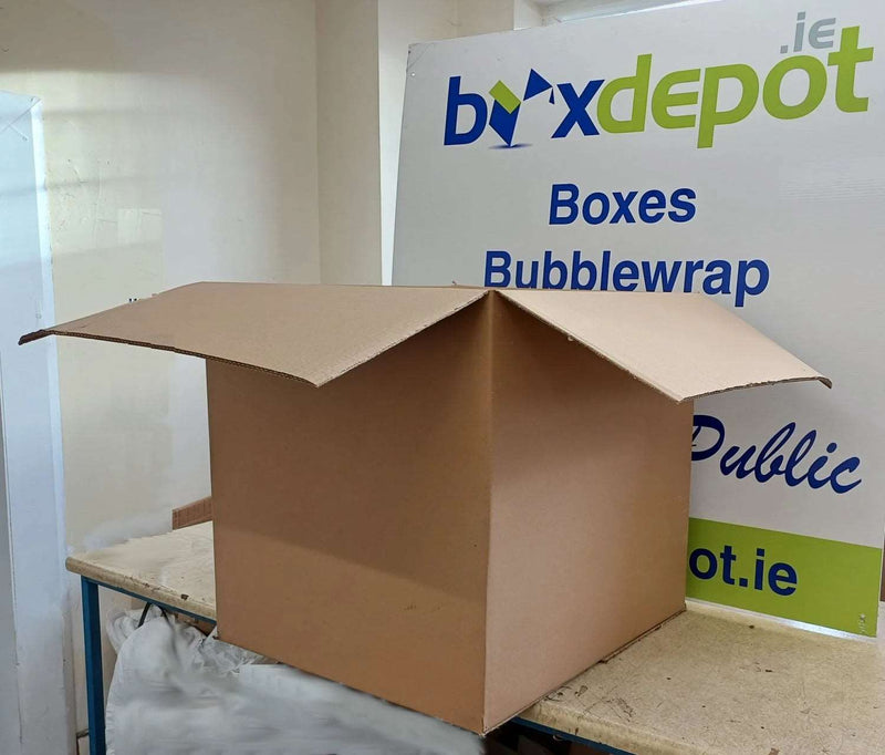 extra-large double walled cardboard box open to emphasise it's size in front of Box Depot advertisement