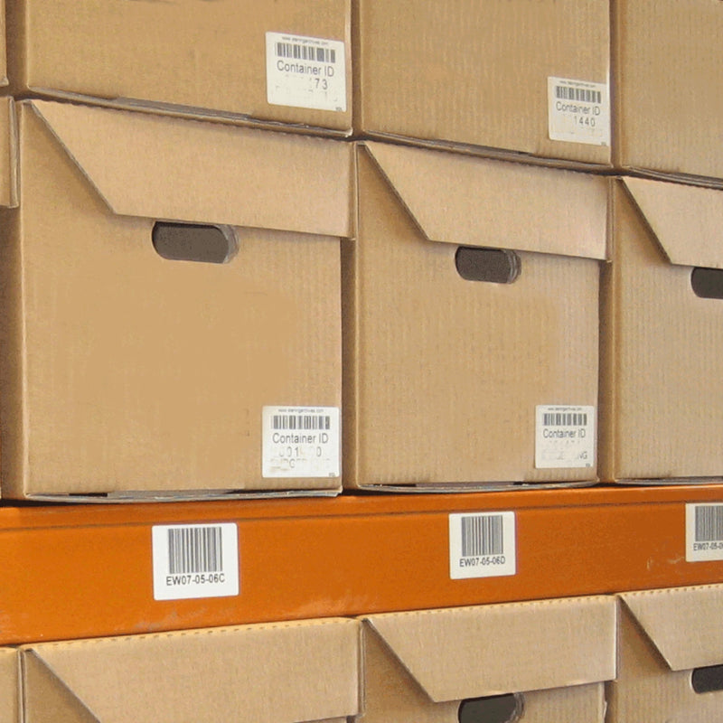 closeup of cardboard archive boxes stacked on a warehouse shelf.