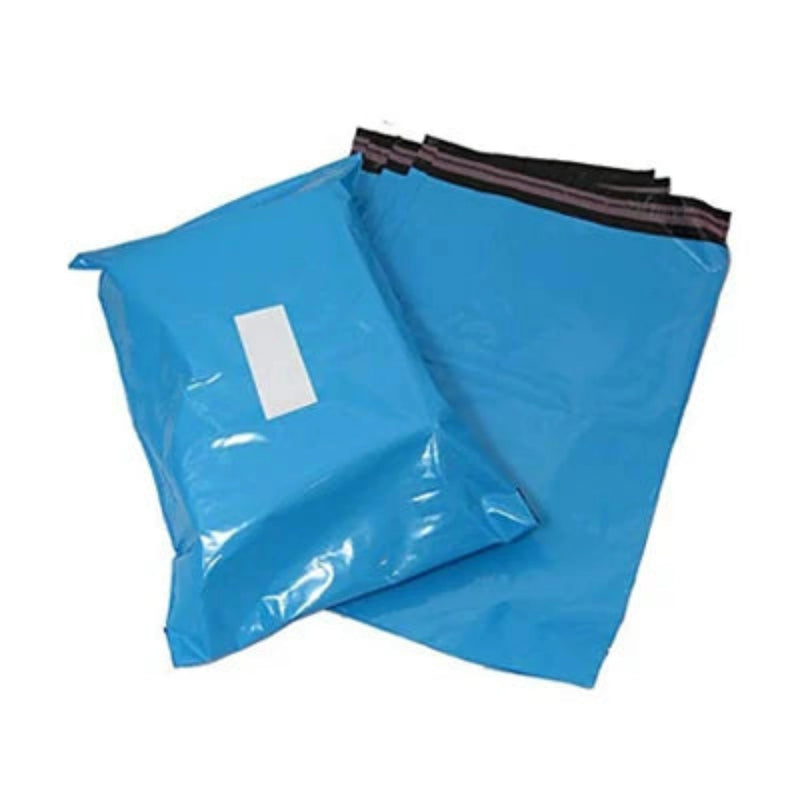a pile of blue mailing bags with one mailing bag filled and labelled on a white background