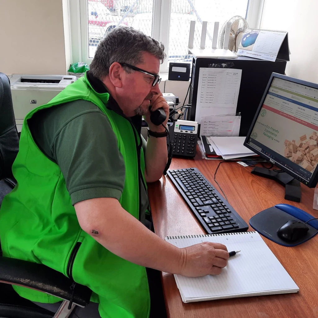 Jerry from Box Depot answering a telephone call in the Box Depot office