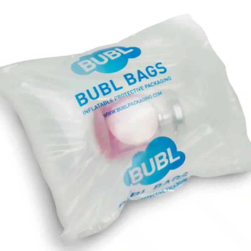 a bottle of perfume inside a protective bubl air cushioning bag on a white background