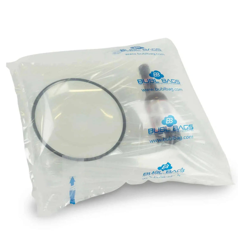 a china bowl and a bottle inside an inflated protective bubl air cushioning bag on a white background