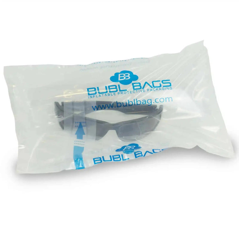 a pair of sunglasses inside an inflated protective bubl air cushioning bag on a white background