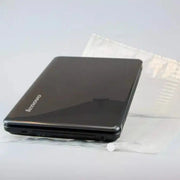 black laptop on an uninflated Bubl air cushioning pod on a plain background