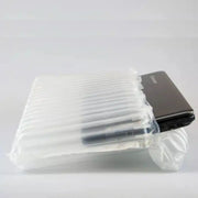 a 15" laptop protected by a Bubl air cushioning pod on a plain background