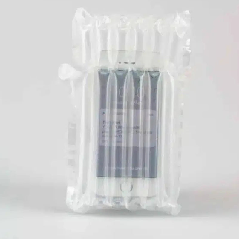 an operating mobile phone inside an inflated protective Bubl air cushioning pod on a plain background