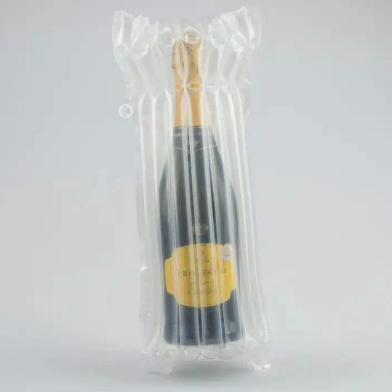 a bottle of prosecco in an inflated Bubl Single air cushioning pod on a plain background