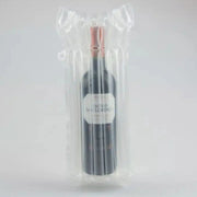 a bottle of wine in an inflated Bubl Single air cushioning pod on a plain background