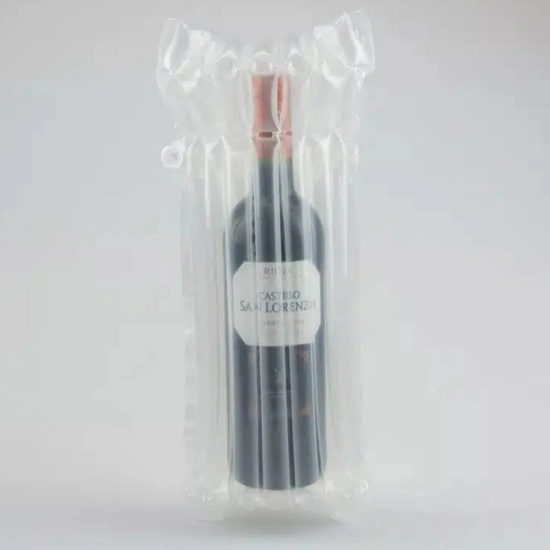a bottle of wine in an inflated Bubl Single air cushioning pod on a plain background