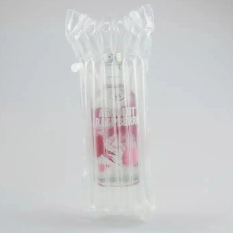 a bottle of vodka in an inflated Bubl Single air cushioning pod on a plain background