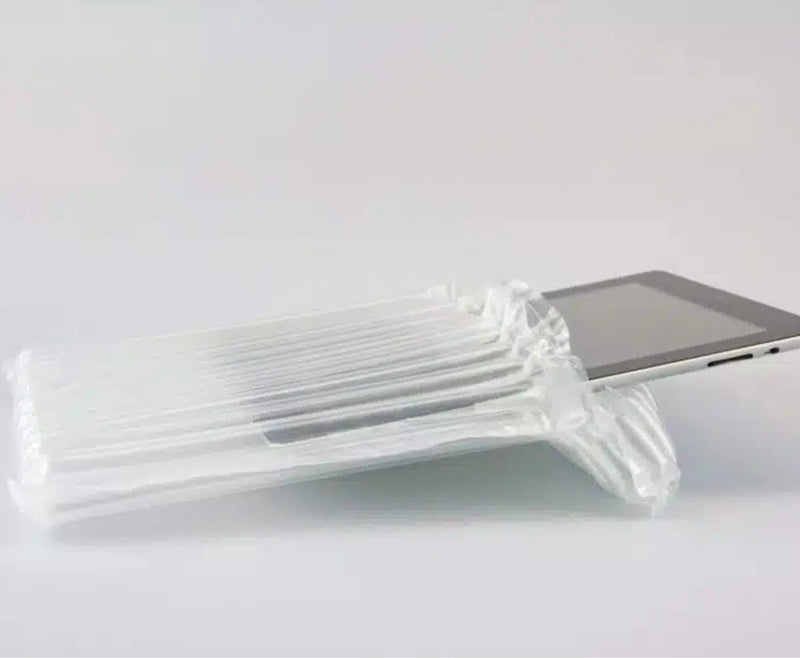 a computer tablet inside an inflated protective bubl air cushioning pod on a plain background