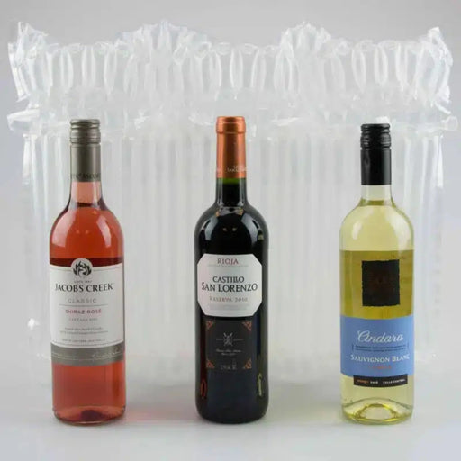 three bottles of wine in front of an inflated Bubl Triple air cushioning pod on a plain background