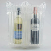 Two bottles of wine protected by an inflated Bubl Twin air cushioning pod on a plain background