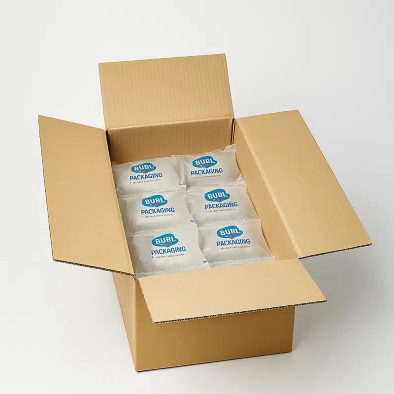 a brown cardboard box filled with Bubl Void 12x20 air cushioning on a white background