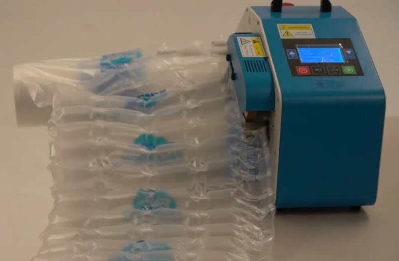 A Bubl inflation machine with void air cushioning packaging being inflated on a plain background
