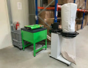 A CushionPack CP320 Cardboard Shredder with a dust extractor in a warehouse