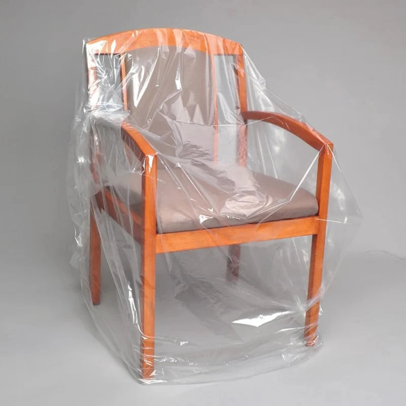Dining chair covered with a clear chair bag on a neutral background