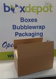 A brown cardboard box with its flaps open, placed in front of a ox Depot advertising board