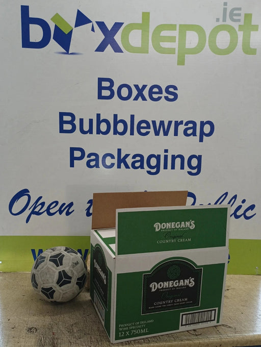 Small single walled cardboard box beside a football for perspective in front of Box Depot advertising