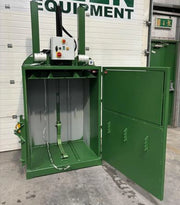 front view of  a GE200 cardboard baler with the door open in warehouse surroundings