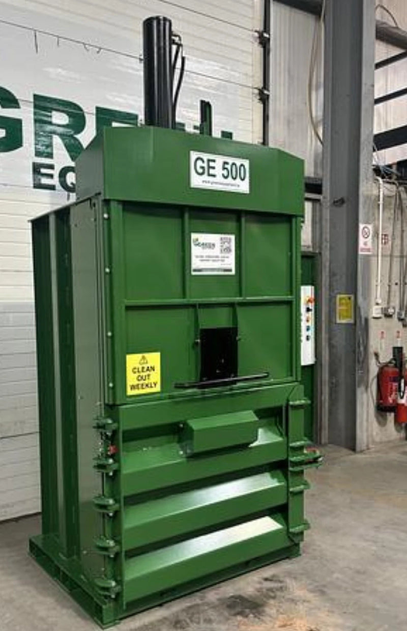 the front and left view of a GE500 Cardboard Baler in a warehouse environment
