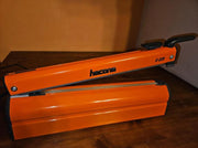Hacona C20 Heat Sealer on a wooden table in a work environment