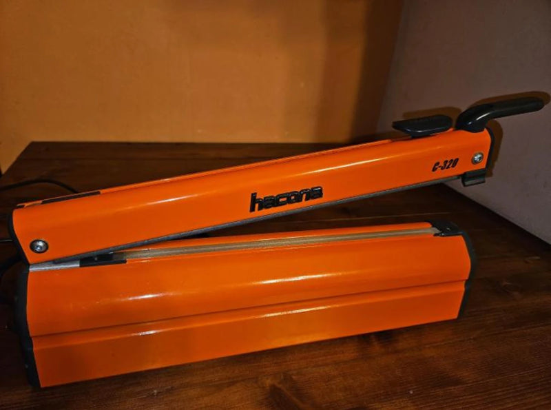 Hacona C20 Heat Sealer on a wooden table in a work environment