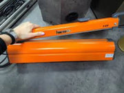 Man holding a Hacona C20 Heat Sealer in a warehouse environment