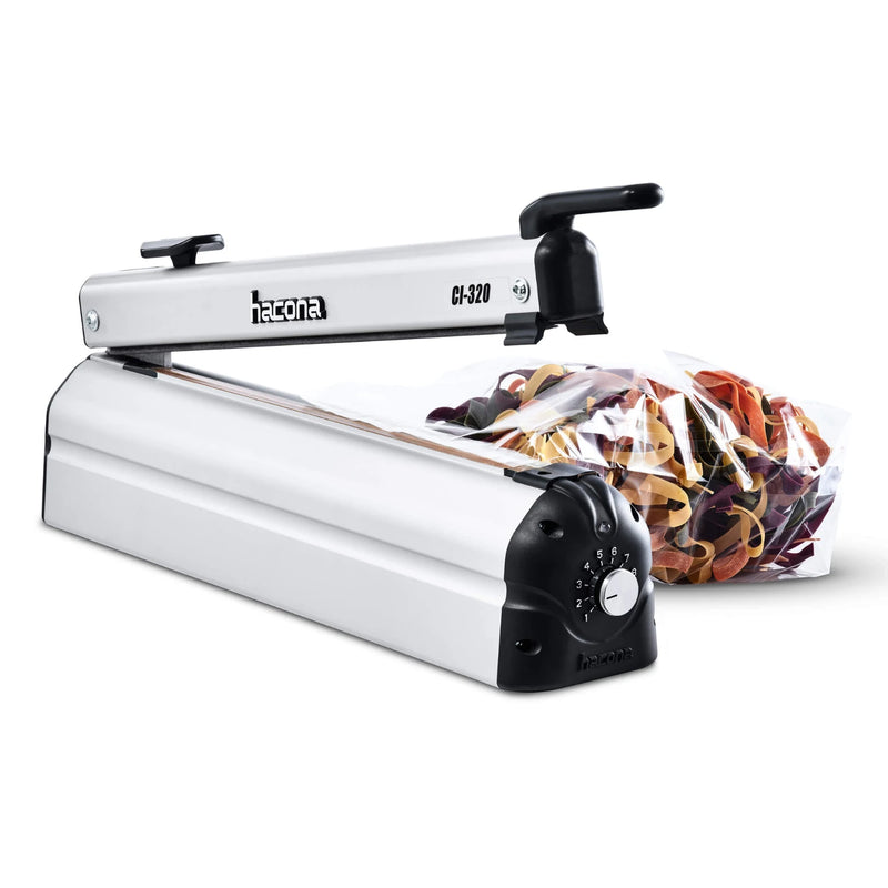 Hacona CI320 inox Heat Sealer beside a sealed clear bag of pasta on a white background