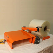 Hacona Heat Sealer with Roll Dispenser and Tabletop on a desk