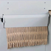view of cardboard leaving via a flap on the back of a Kobra Desktop Cardboard Shredder