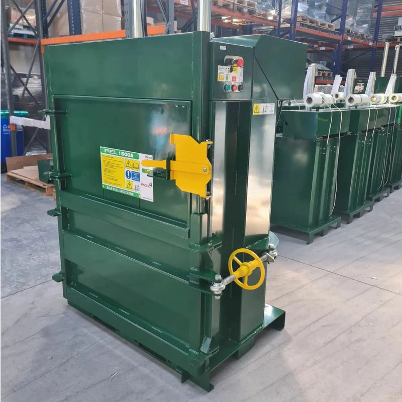 PEL1500  industrial compactor cardboard baler with yellow handle in a warehouse setting