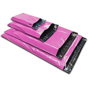a pile of four different sizes of pink mailing bags on a white background