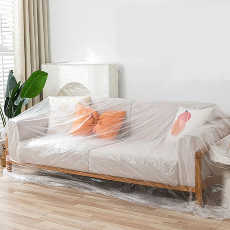 two seat sofa in a neutral living room covered with a two-seat sofa cover