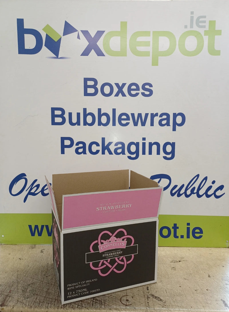 pink and black cardboard box in front of Box Depot advertising