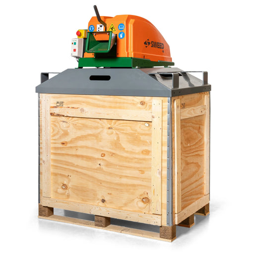 A Sweed CE450DDX Strapping Chopper sitting on an enclosed wooden pallet box on a white background