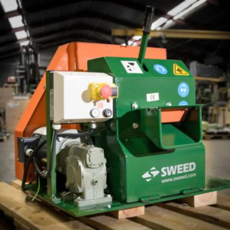 Sween CE510 Strapping Chopper machine resting on a pallet in a warehouse