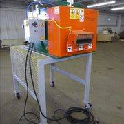 Sweed CE517 Pallet Strapping Chopper on a metal table in a warehouse setting