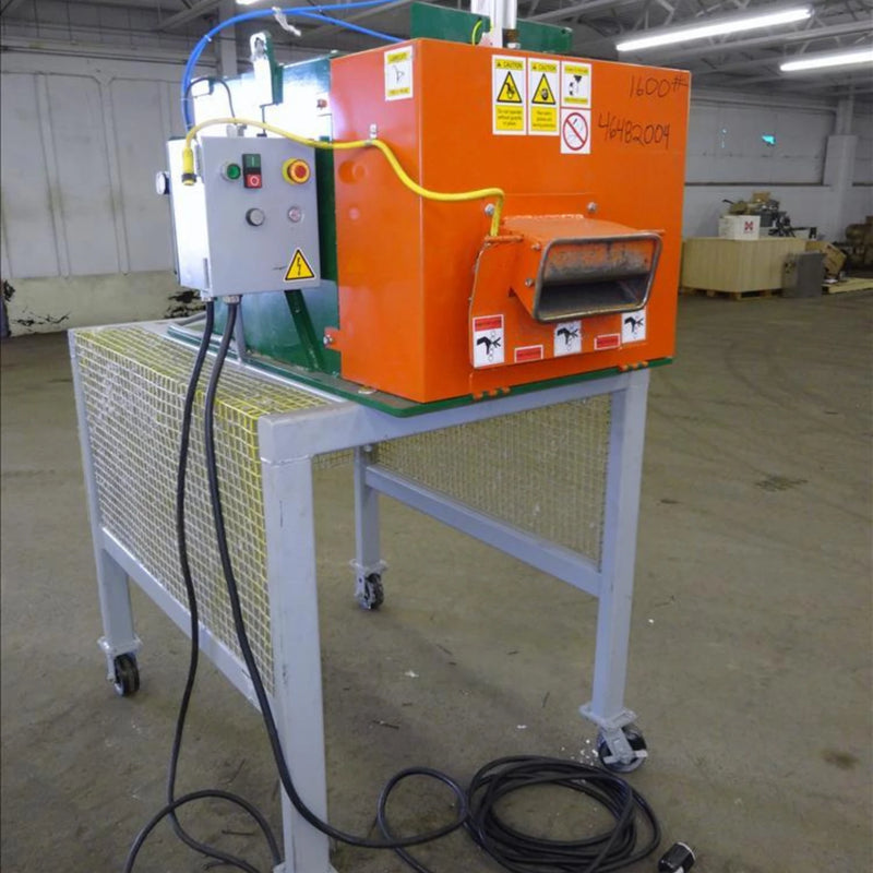 Sweed CE517 Pallet Strapping Chopper on a metal table in a warehouse setting