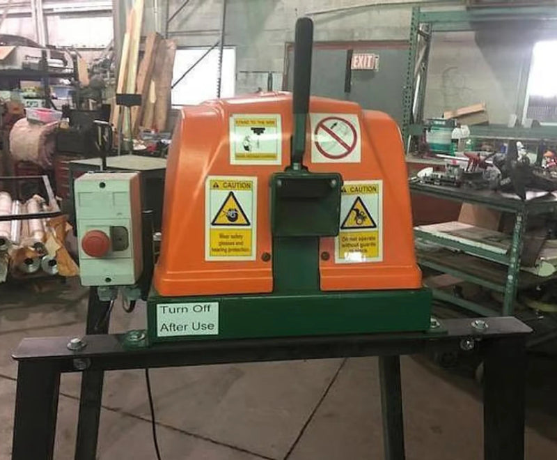 A Sweed CE300 Pallet Strapper on a black stand in a warehouse