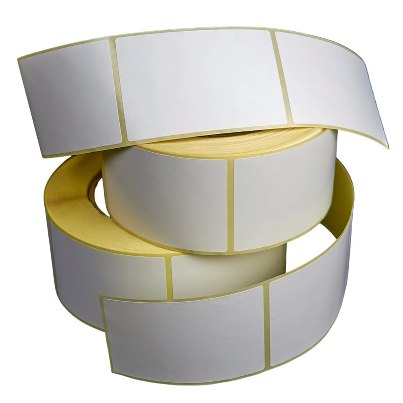 Two rolls of white labels on a white background