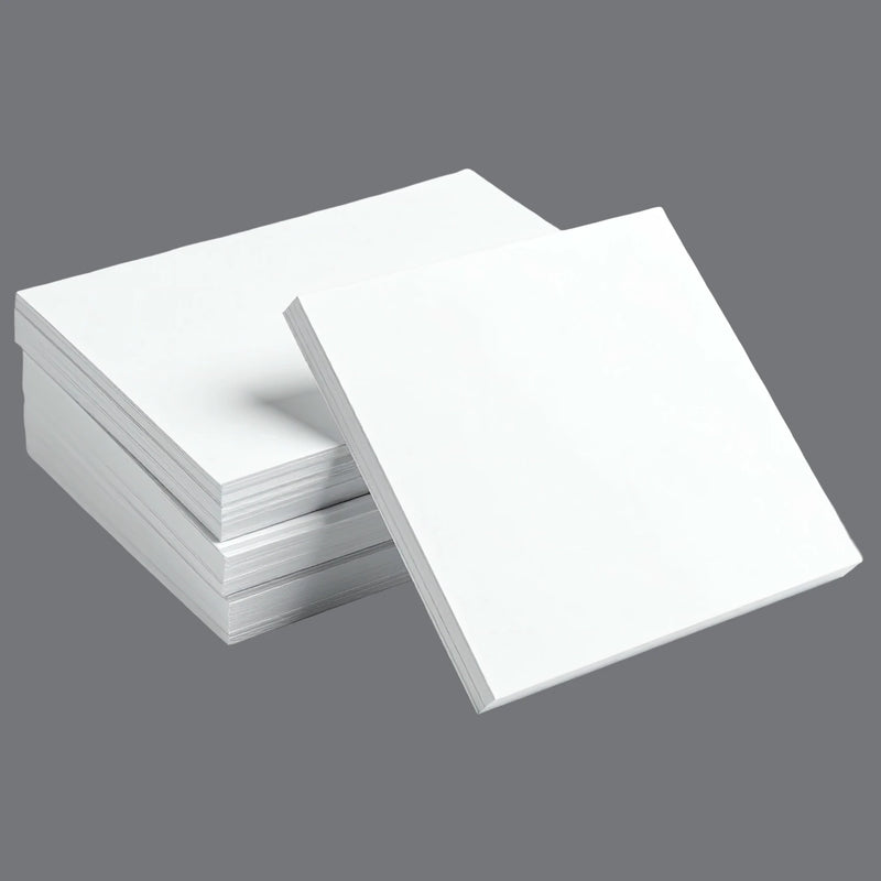 four reams of white packing paper on a grey background
