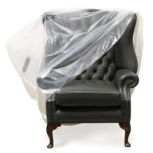 armchair with a plastic chair cover placed over it on a white background
